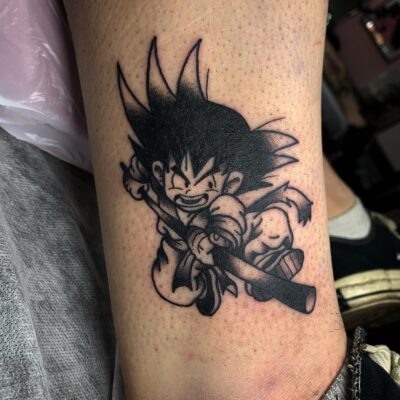 Kid Goku With Power Pole Leg Tattoo