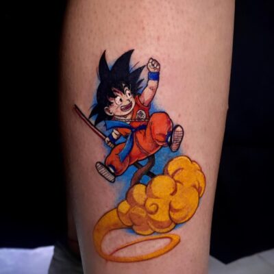Happy Kid Goku Flying Arm Tattoo